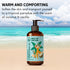 Bottle of coconut vanilla body oil with a beach background